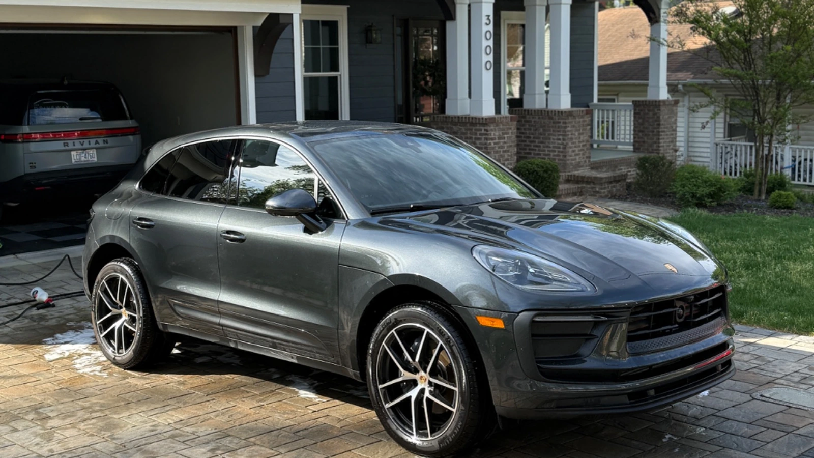Grey Porsche Macan parked at a client’s home